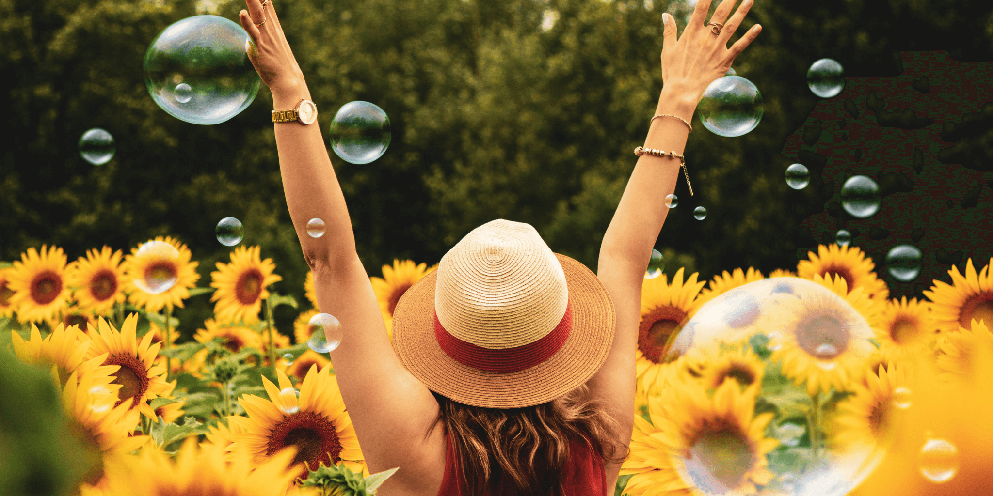 Woman standing in a field with sunflowers – calm, joyful. 